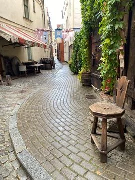 A stone walkway with a bench on it Stock Photos