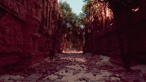 A stone walkway between buildings Ilustración de archivo