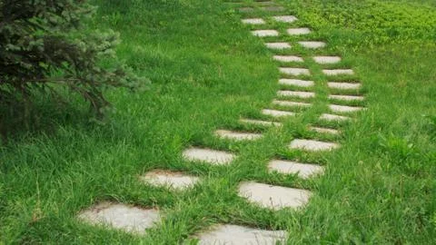 Stone walkway on the grass Stock Photos