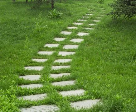 Stone walkway on the grass Stock Photos