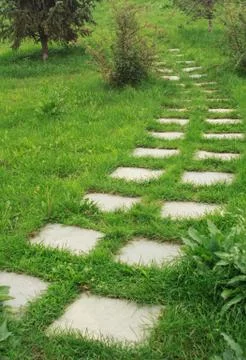Stone walkway on the grass Stock Photos