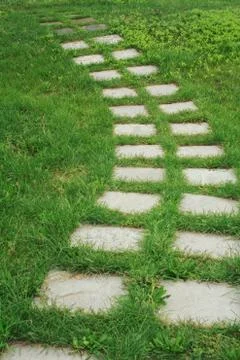 Stone walkway on the grass Stock Photos