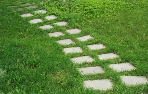 Stone walkway on the grass Stock Photos
