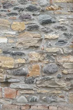 Stone wall Ancient wall made up of irregular stones with warm colors Copyr... Stock Photos
