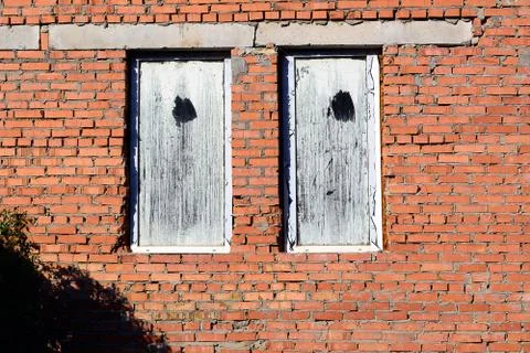 Stone wall and blue window shutter. Traditional house Stock Photos
