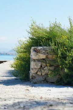 Stone wall and walking path on Sovalye Island Stock Photos