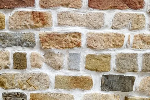 Stone wall backdrop of a rustic house Stock Photos