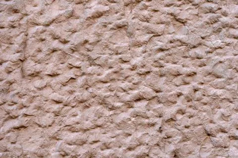 Stone wall background. Aged sand stone walling for texture and design backgro Stock-Fotos