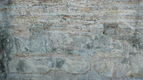 Stone wall background with ancient stonework. Close-up of a dilapidated stone Stock-Fotos