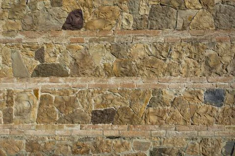 Stone wall background and ancient tuff, Tuscany in Italy 写真素材