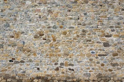 Stone wall background and ancient tuff, Tuscany in Italy Stockfoto's