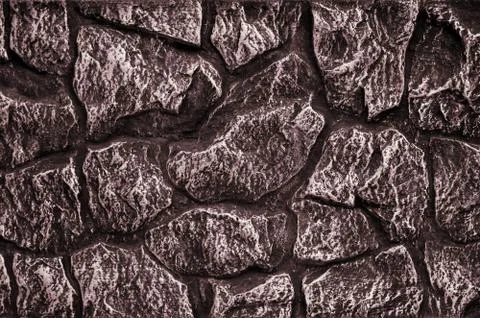 Stone wall background - building feature. Texture of thick and strong wall of 写真素材