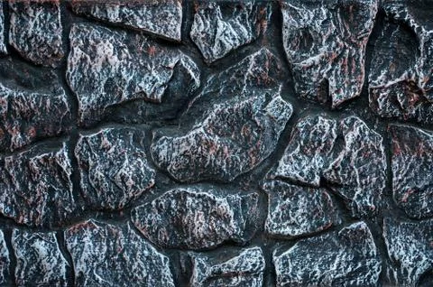 Stone wall background - building feature. Texture of thick and strong wall of Foto stock
