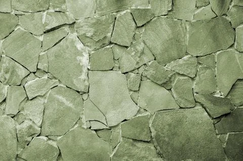 Stone wall background - building feature. Texture of thick and strong wall of Foto stock