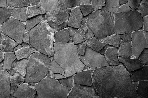 Stone wall background - building feature. Texture of thick and strong wall of Foto stock