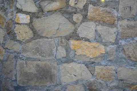 Stone wall, background in gray-yellow color, High quality photo Stock Photos