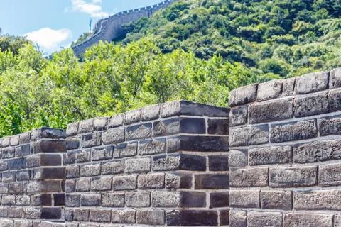 Stone wall on the background of mountains Stock Photos