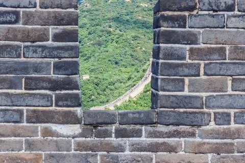Stone wall on the background of mountains Stock Photos