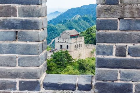 Stone wall on the background of mountains Stock Photos