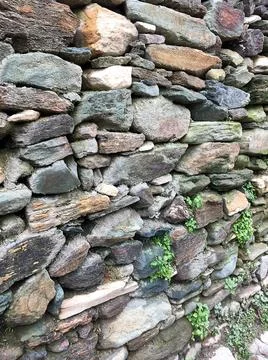 Stone wall background in near plan Stock Photos