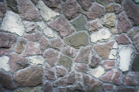 Stone wall as a background or texture Stock Photos
