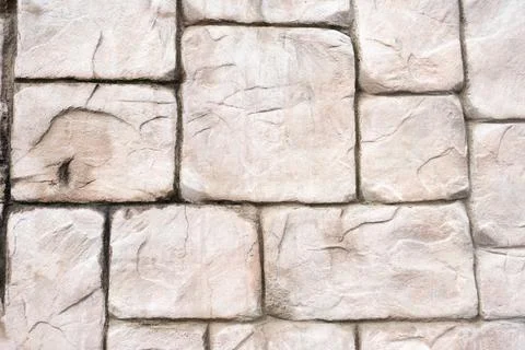 Stone wall as a background or texture. antique wall. pink stone. building. Fotos de archivo