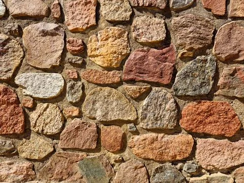 Stone wall as background or texture. modern style design decorative uneven .. Stock Photos