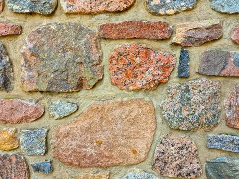 Stone wall as background or texture. modern style design decorative uneven .. Stock Photos