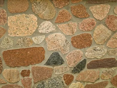 Stone wall as background or texture. modern style design decorative uneven .. Stock Photos