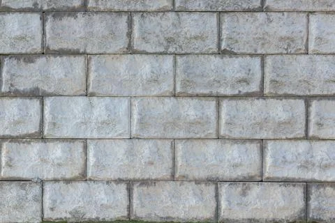 A stone wall as a background or texture. Masonry used as exterior wall claddi Stock Photos