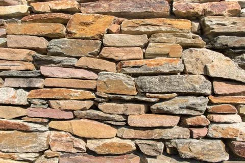 Stone wall background Stock Photos