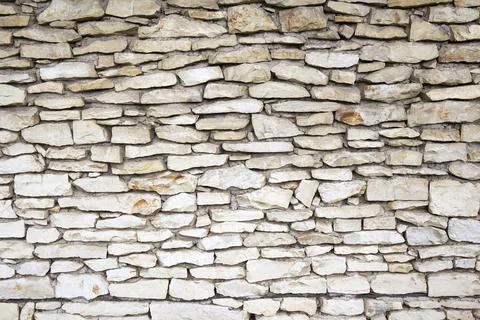 Stone wall a background Stock Photos