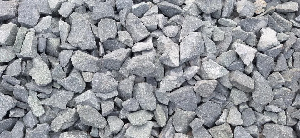 Stone wall background .Rocks display rough textures. Stock Photos