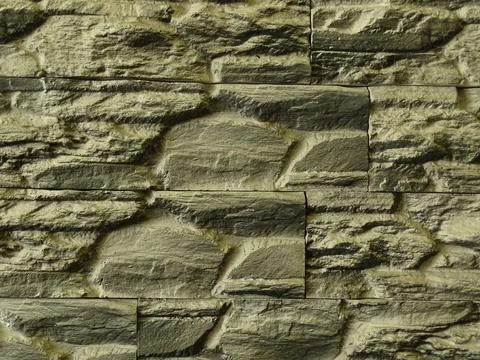 Stone wall background with rough textured surface 스톡 사진