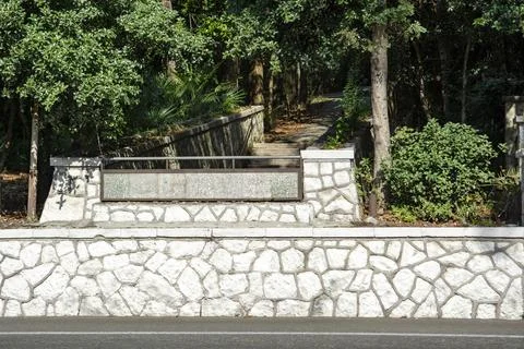 Stone wall background texture. Building facade, High fence made of stone bloc Stock Photos