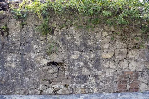 Stone wall background texture. Building facade, High fence made of stone bloc Foto stock