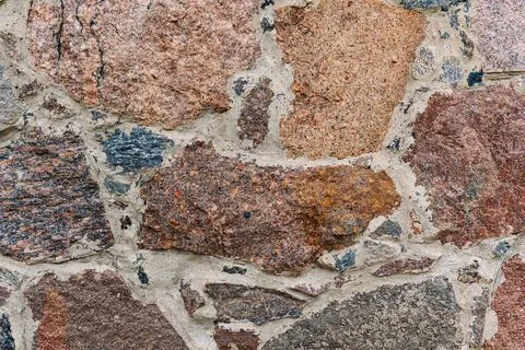 Stone wall background texture. Close-up of old building wall Stock Photos