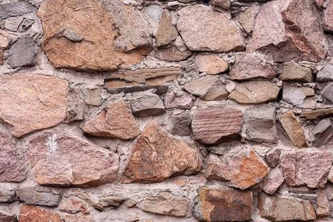 Stone wall background. texture close-up Stock Photos