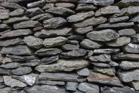 Stone wall background. Wall built of stone Stock Photos