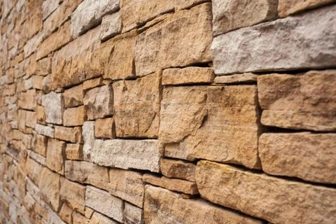 Stone wall background Wall made of cavern rock Stock-Fotos