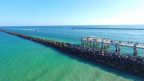 Stone wall by beach, aerial Video stock 73795053