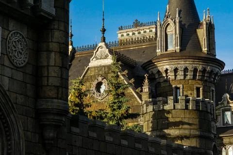Stone wall behind which there is a round corner tower of a stone castle, behind Stock Photos
