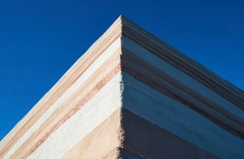 Stone wall with the blue sky Stock Photos