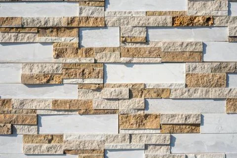 Stone wall brick texture background beige and white surface facade. Close - up. Stock Photos