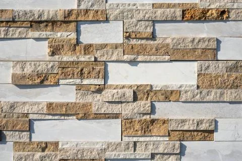 Stone wall brick texture background beige and white surface facade. Close - up. Stock Photos