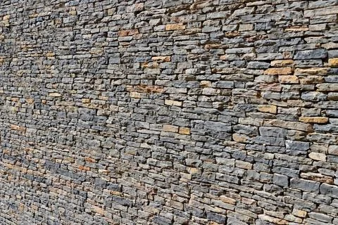 Stone Wall Cladding from natural stone close up Fotos Stock