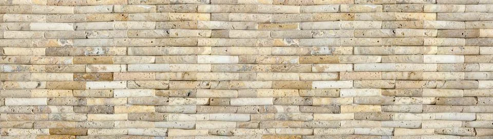 Stone wall cladding pattern creating rustic texture background Stock Photos