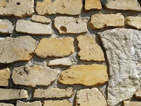 Stone wall close up. Abstract old background. Stock Photos