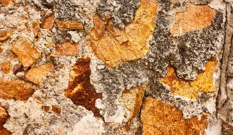 Stone wall close-up. The background of an old wall. Stock Photos