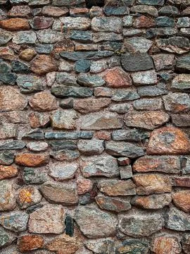 Stone wall close up, background or texture. Part of a large stone for background Stock Photos